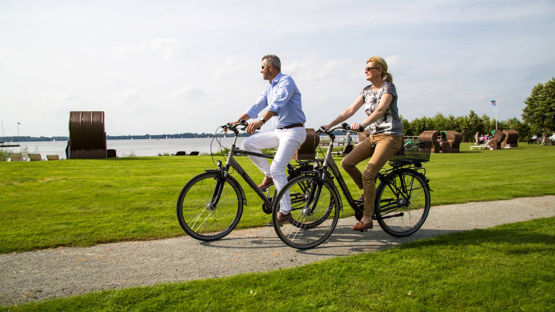 Woman and man riding a bicycle