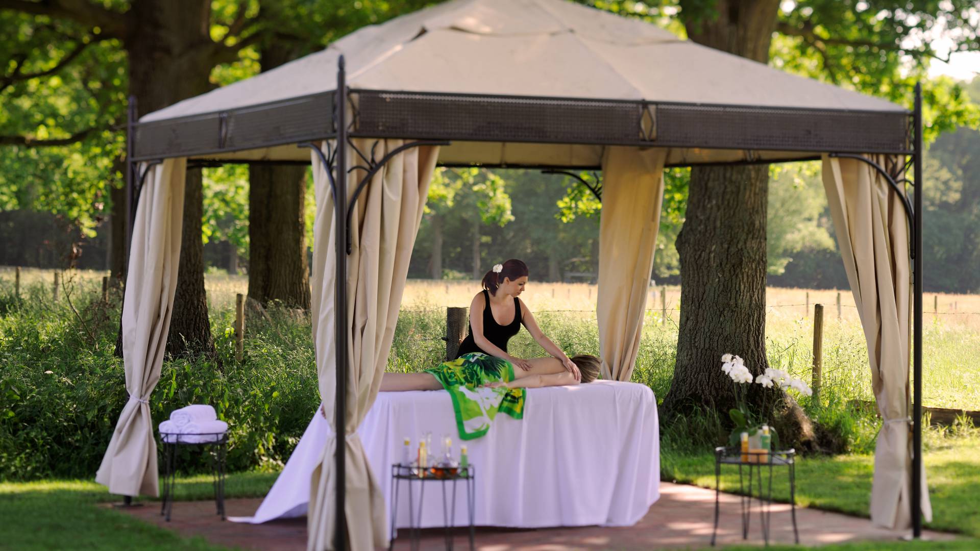 Massage under pavilion in the garden of the Eiden Spa
